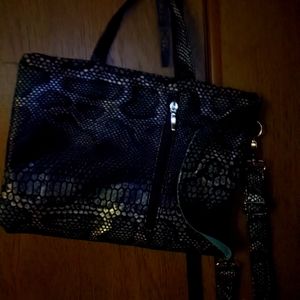 Carries tablet and purse bag